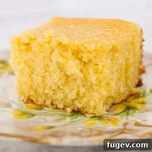 Sweet Cornbread Perfection 11 sweet cornbread slice on vintage plate with yellow flowers.
