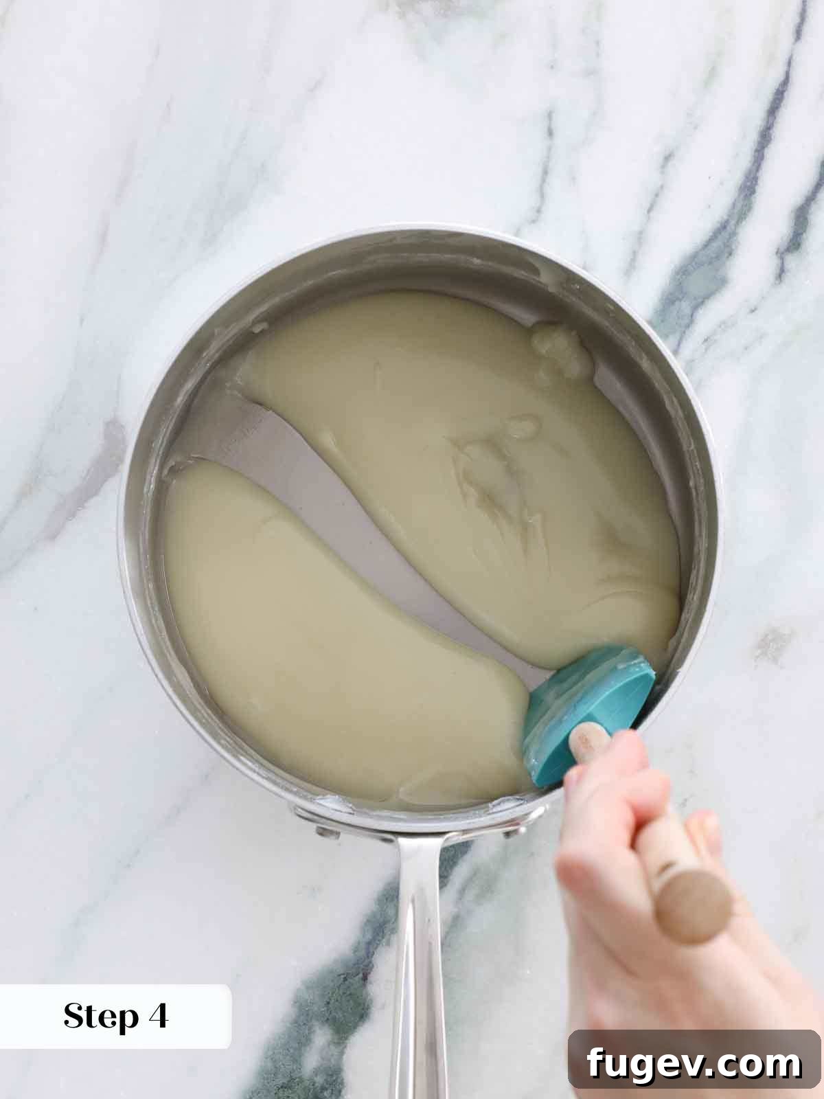 Silky Smooth Ermine Buttercream 9 Flour base for frosting still too thin and flowing freely from the spoon, indicating it needs more cooking time.