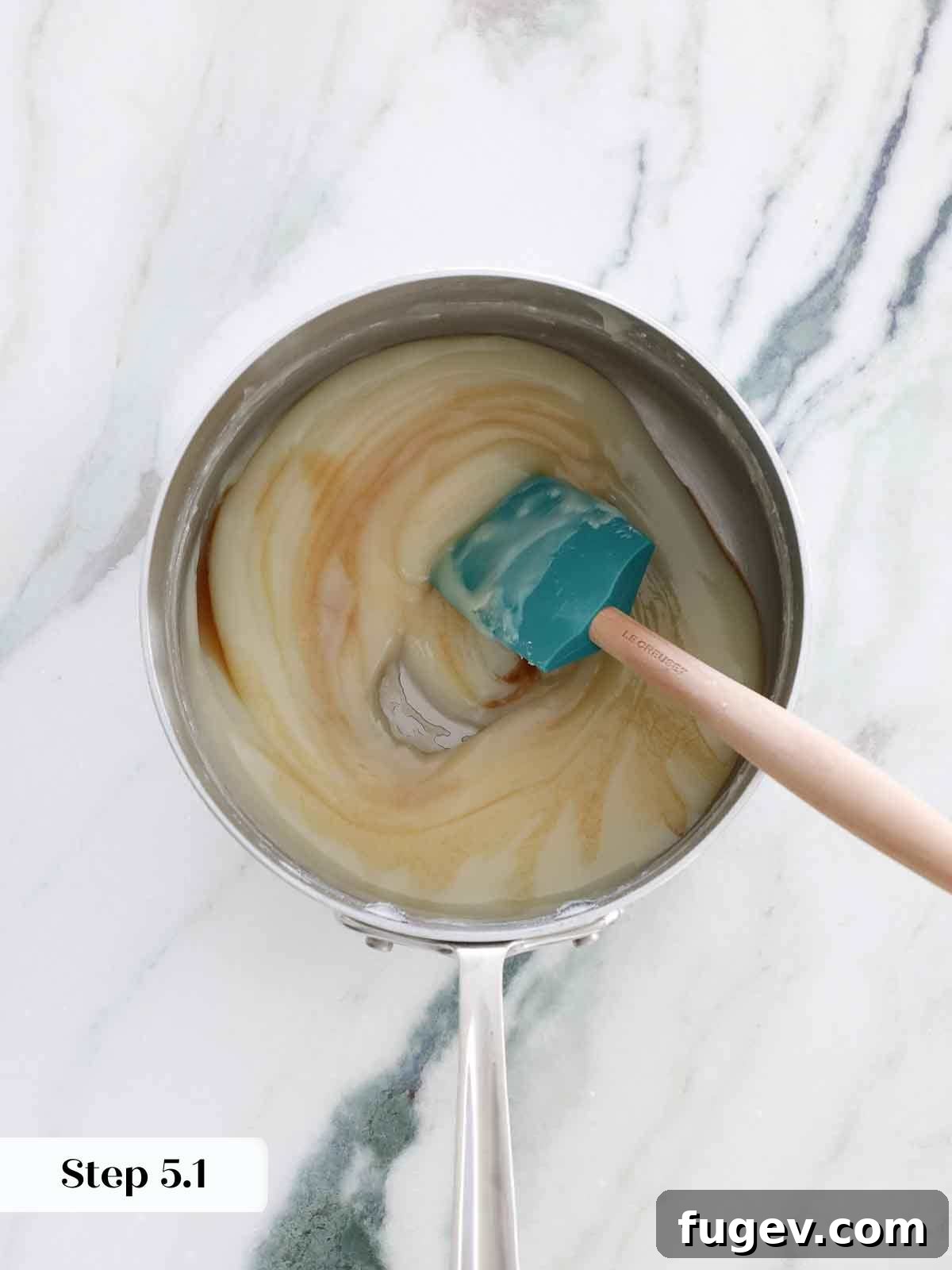 Silky Smooth Ermine Buttercream 10 Adding vanilla extract to the cooked flour base, enhancing the flavor of the ermine frosting.