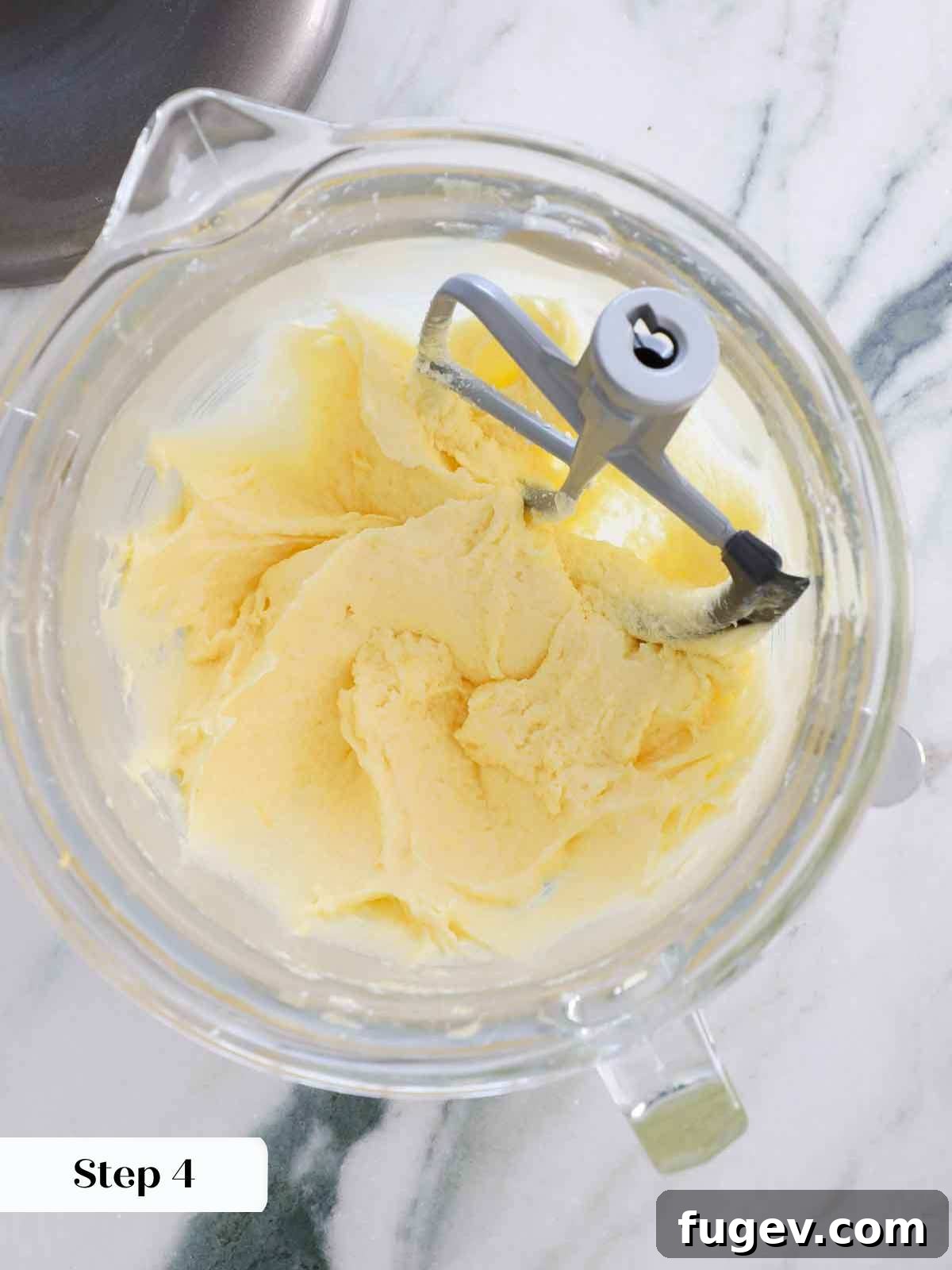 Golden Vanilla Bliss 8 Smoothly emulsified eggs incorporated into the butter and sugar mixture, creating a rich base for the batter.