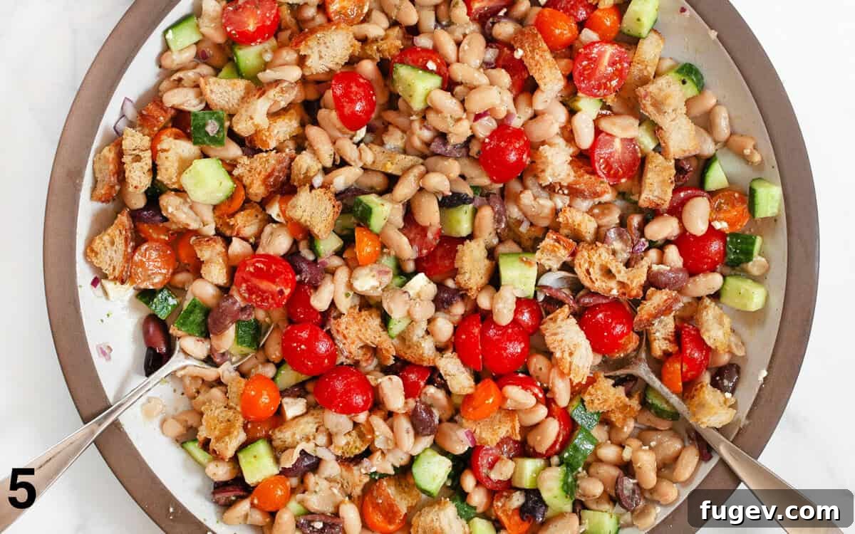 Tuscan White Bean Salad 6 Toasted croutons gently tossed with the cannellini bean salad in a large serving bowl.