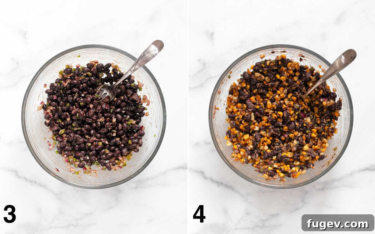 Black beans stirred with red onions, jalapenos, and spices in a bowl, followed by the addition of roasted corn stirred into the mashed beans.
