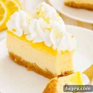 A delectable slice of lemon cheesecake with a fork taking a bite, highlighting its creamy texture.
