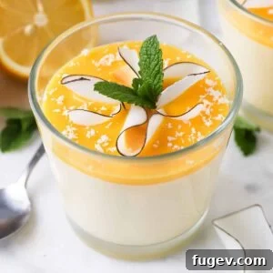 Lemon Mousse garnished with fresh mint on top, presented beautifully.