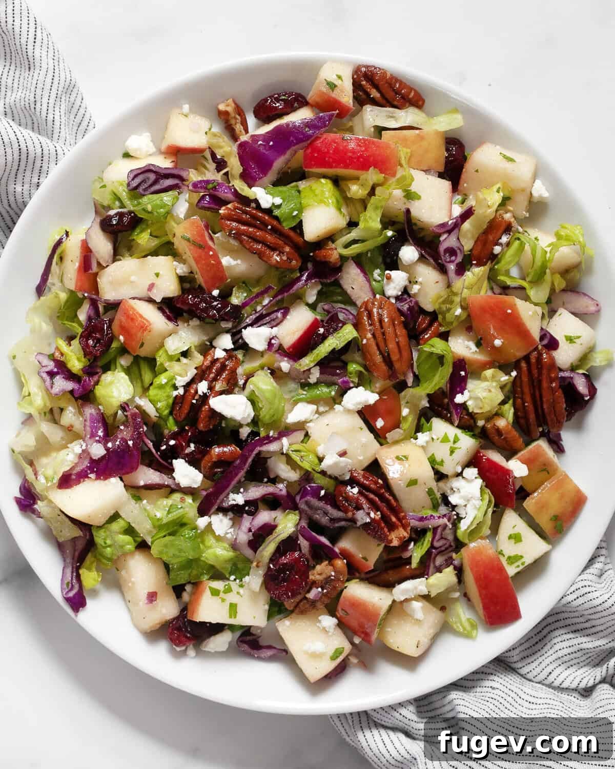 Crisp Apple Pecan Salad 7 Apple pecan salad on a plate.