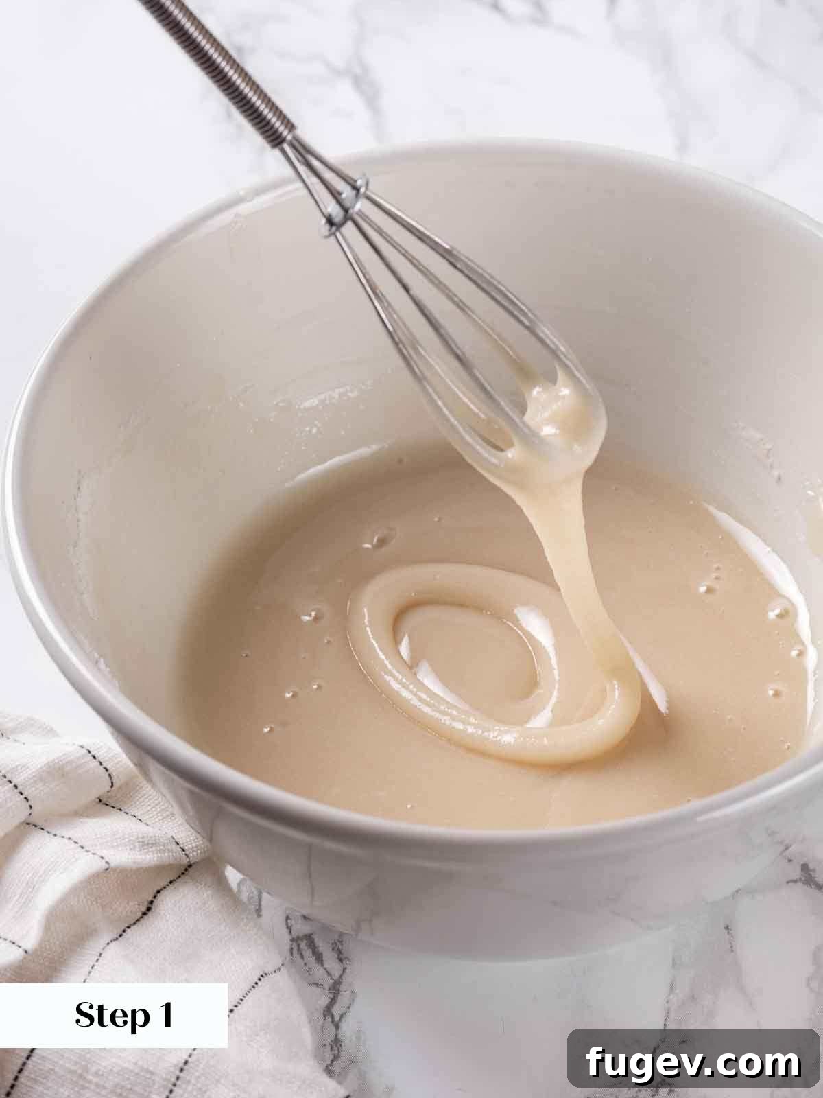 Elegant Choux Doughnuts 14 maple glaze pouring from whisk.