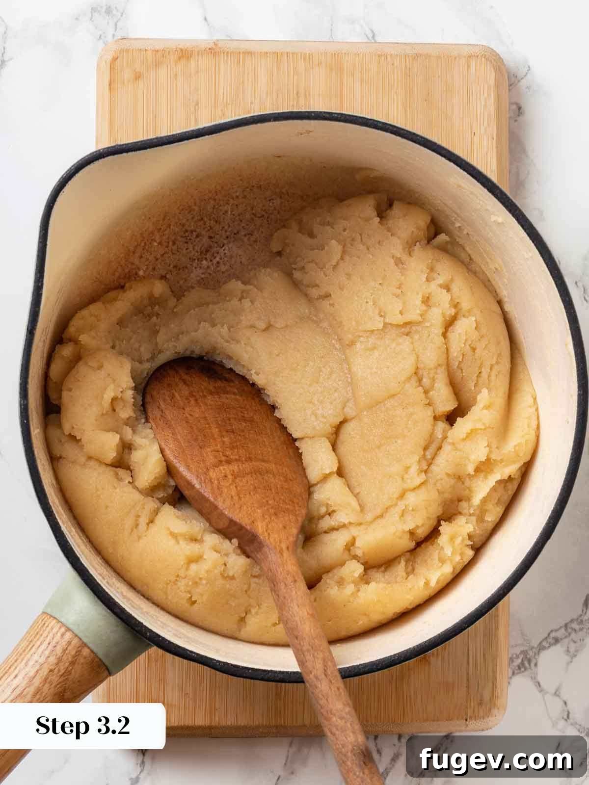 Elegant Choux Doughnuts 10 cooking cruller dough and stirring with wooden spoon.