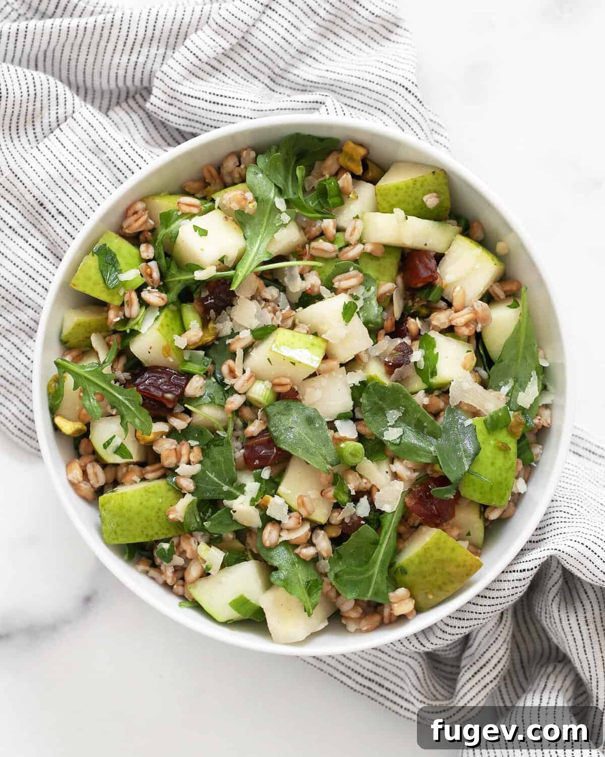 Sweet Pear and Hearty Farro Salad 6 A close-up shot of the finished pear farro salad, showcasing its vibrant colors and various textures, served in a rustic bowl.