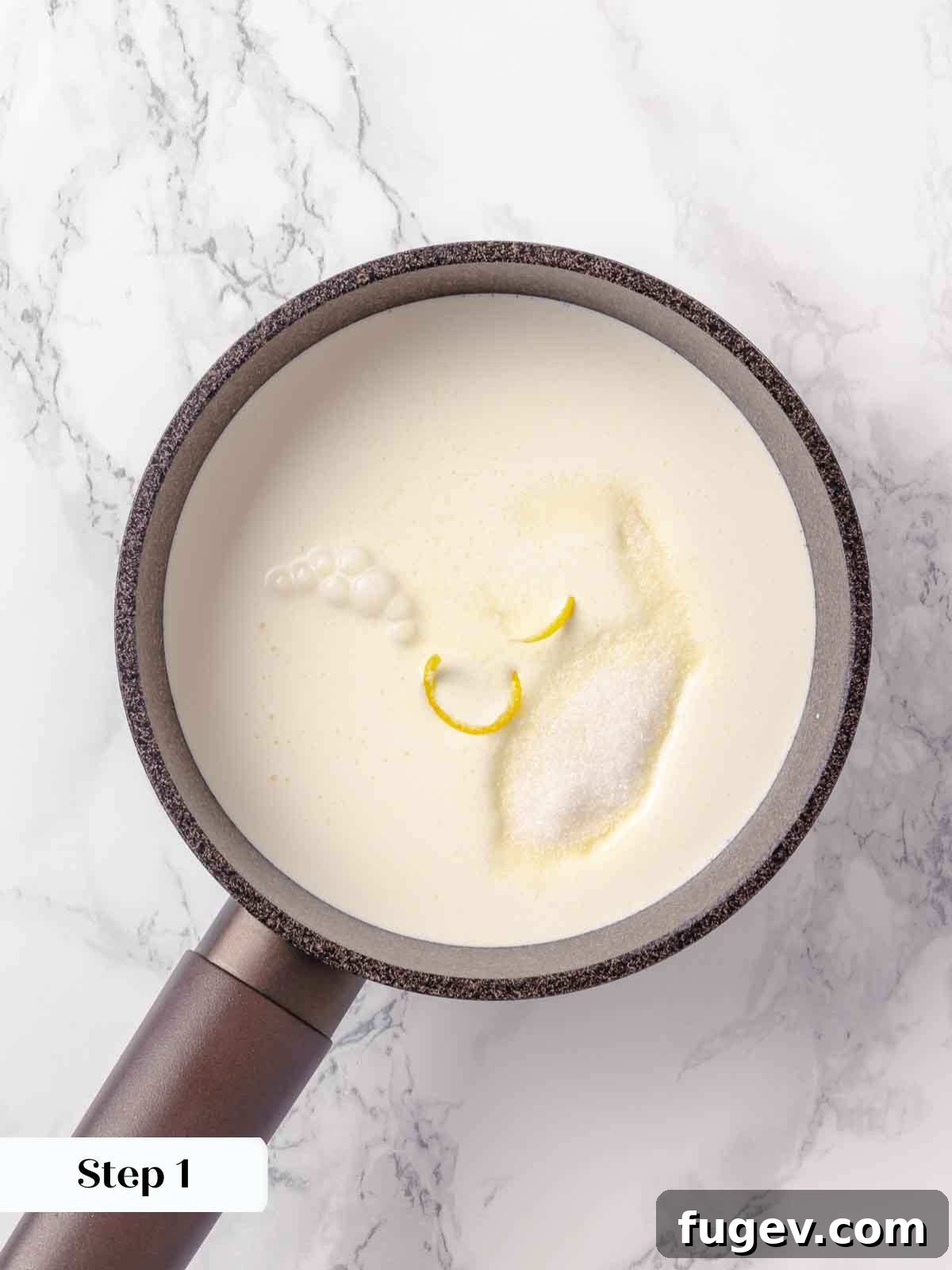 Zesty Lemon Cream 5 A saucepan on a stove, containing heavy cream, sugar, and lemon rind, being heated. The mixture is lightly bubbling as it warms up.