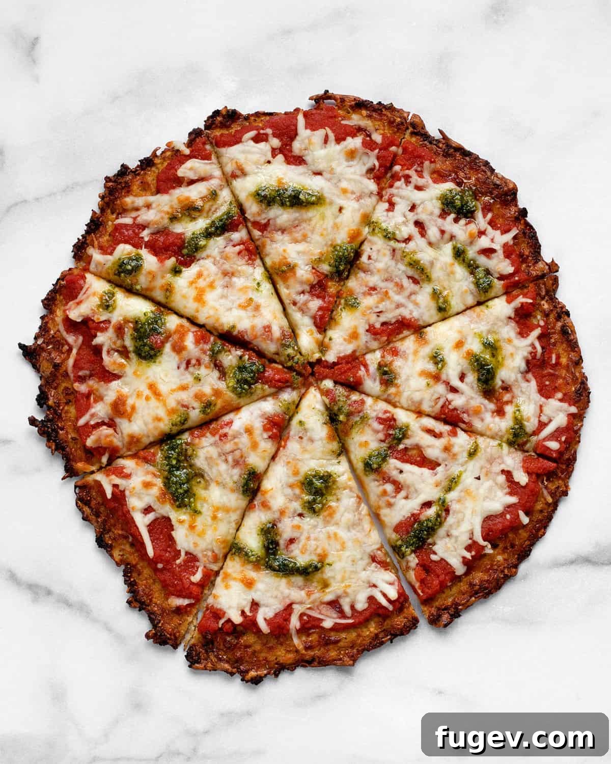 Power Cauliflower Crust 9 A freshly baked cauliflower pizza crust, perfectly sliced into 8 wedges, ready to be enjoyed.