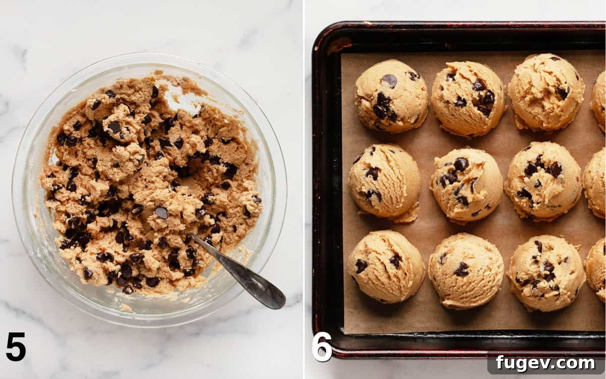 Chewy Chocolate Chip Peanut Butter Cookies 6 A bowl of cookie dough with chocolate chips mixed in, next to a lined baking sheet with evenly scooped cookie dough balls, ready for chilling.