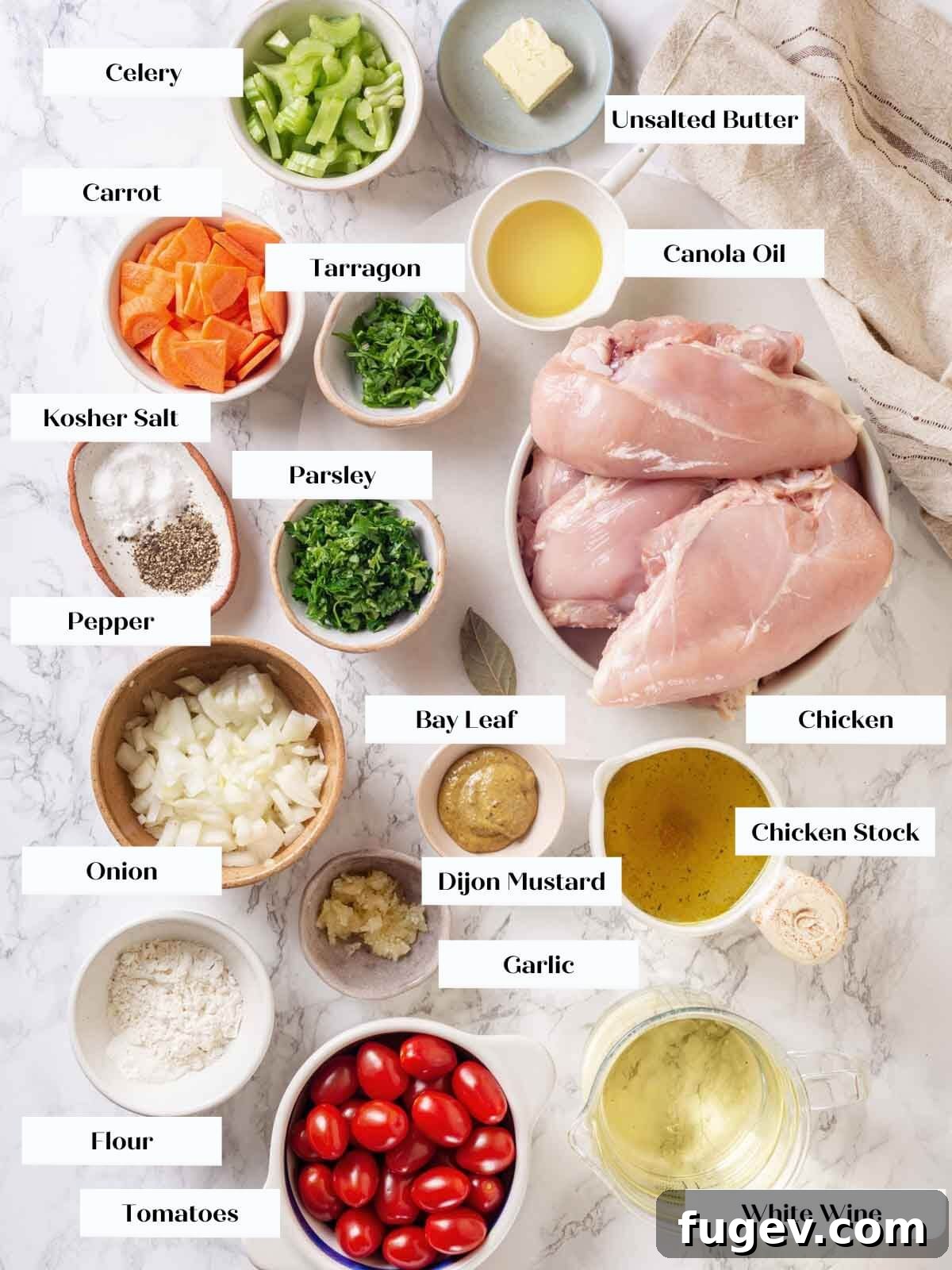 Bright White Wine Chicken 4 A collection of fresh ingredients for chicken in white wine sauce, including chicken, vegetables, herbs, and wine, arranged on a white marble countertop.