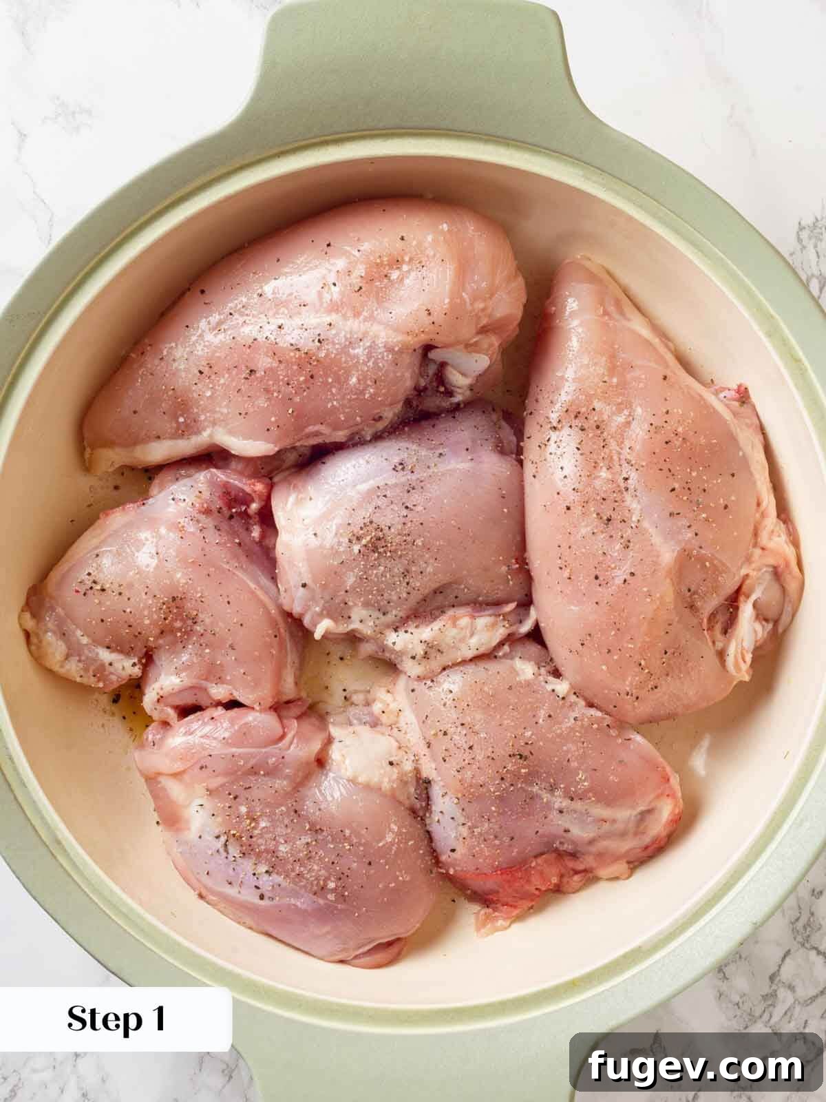 Bright White Wine Chicken 5 Uncooked chicken pieces seasoned with salt and pepper, ready for searing in a skillet.