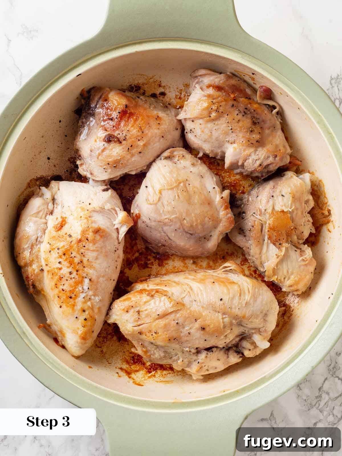 Bright White Wine Chicken 6 Seared chicken pieces browned on both sides in a hot pan, demonstrating proper caramelization.