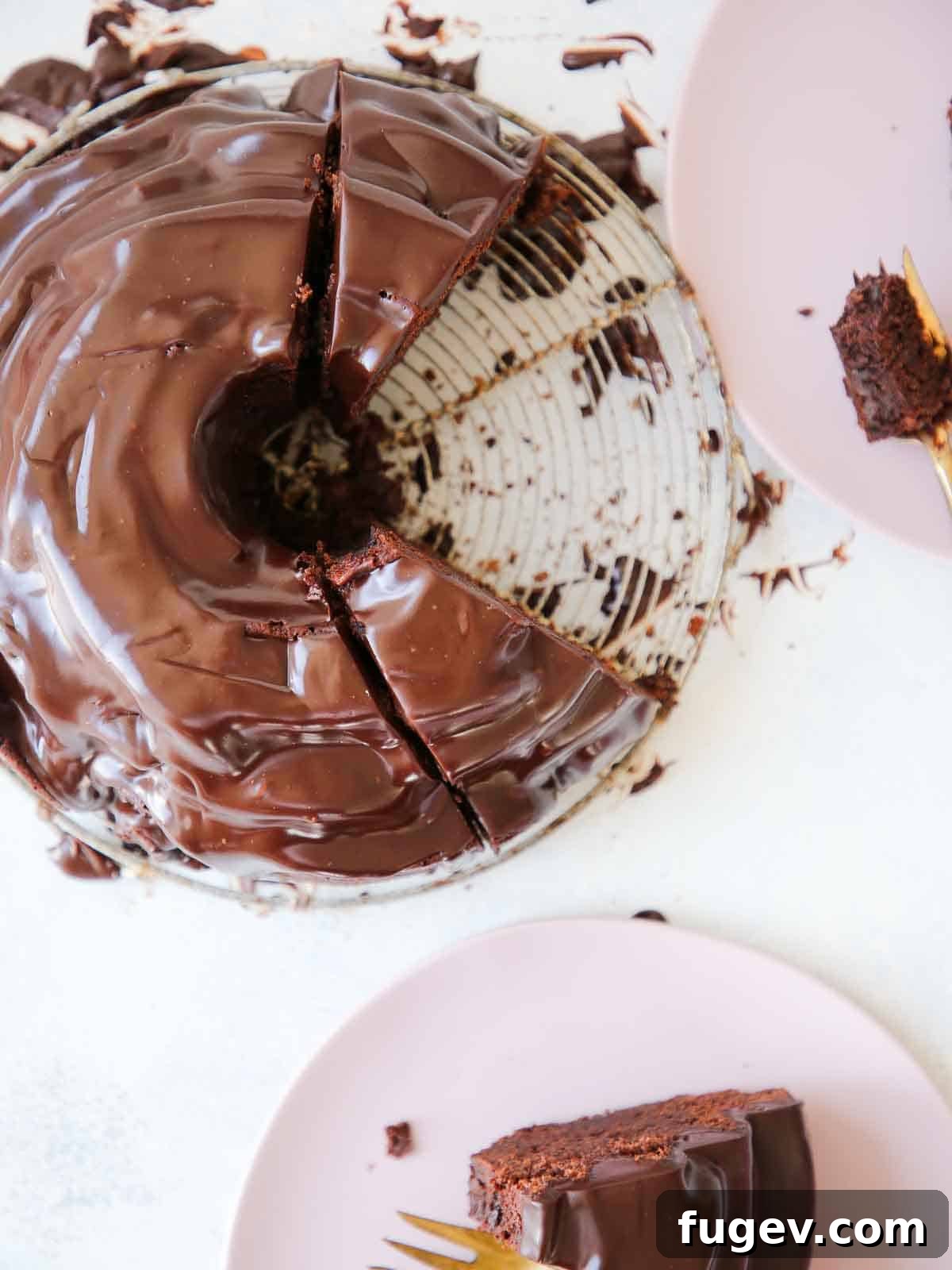 Decadent Chocolate Bundt 6 A close-up of a chocolate bundt cake on a vintage wire rack, with glossy chocolate ganache artfully dripping down its sides, creating a decadent visual.