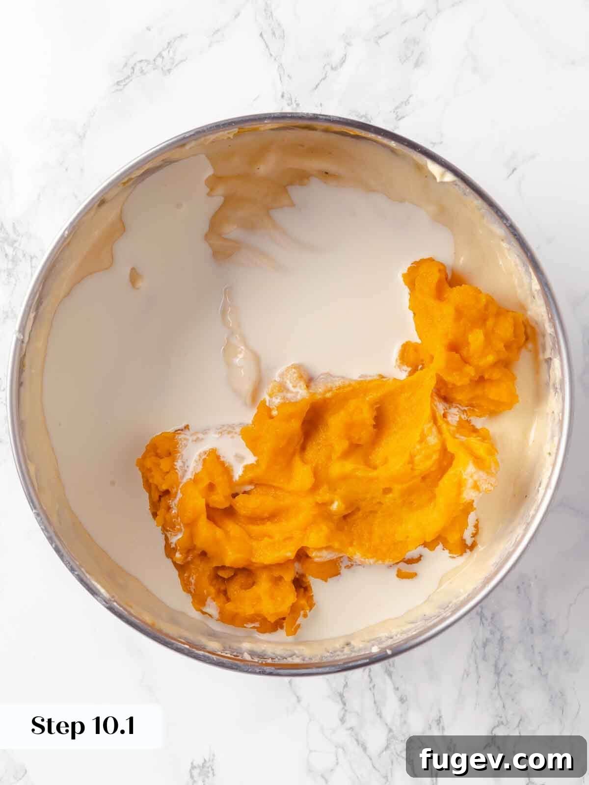 Spiced Pumpkin Cheesecake 15 Adding pumpkin puree during the pumpkin cheesecake process.