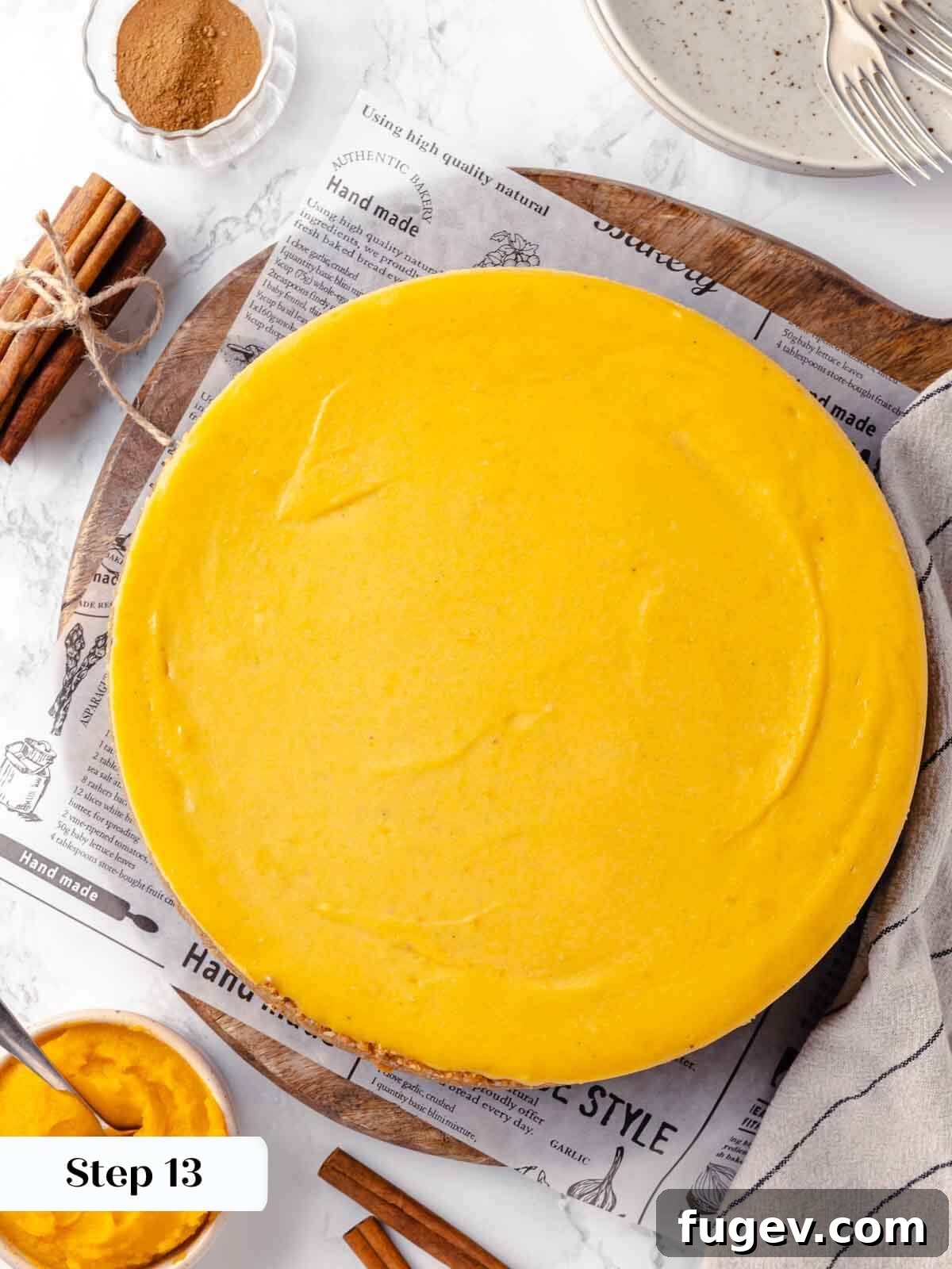 Spiced Pumpkin Cheesecake 19 The process of cooling a pumpkin cheesecake on a wire rack.