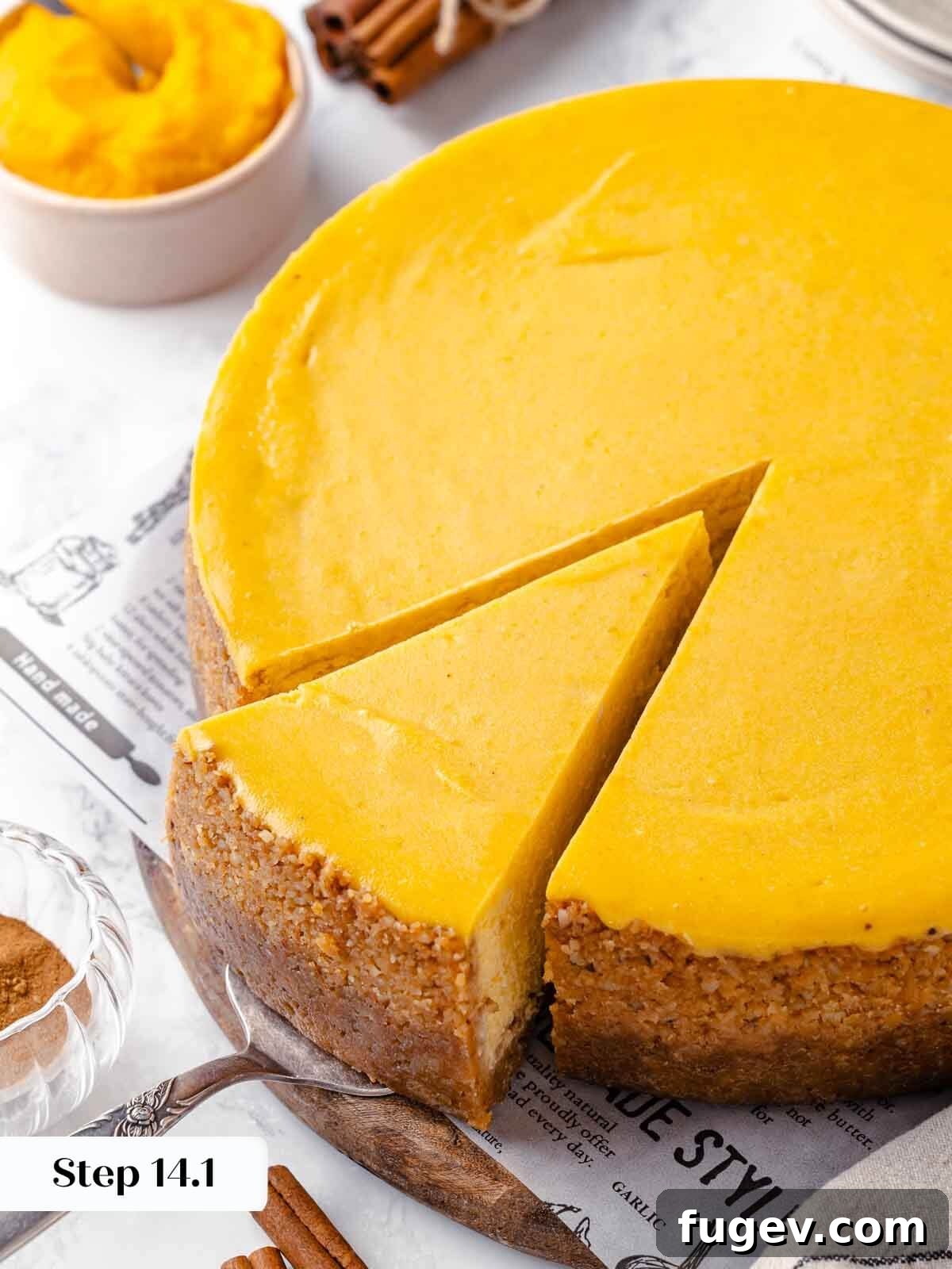 Spiced Pumpkin Cheesecake 20 A perfectly sliced pumpkin cheesecake, ready to serve.