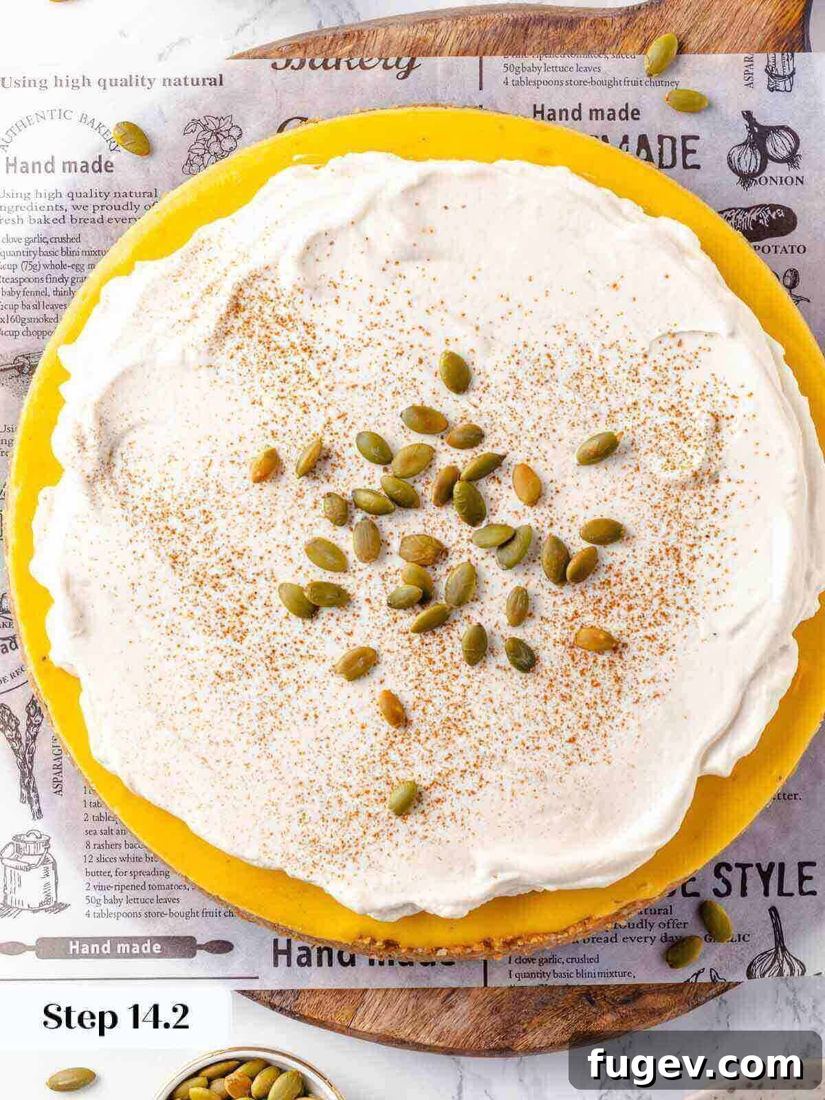 Spiced Pumpkin Cheesecake 21 Pumpkin cheesecake topped with whipped cream, ready for serving.