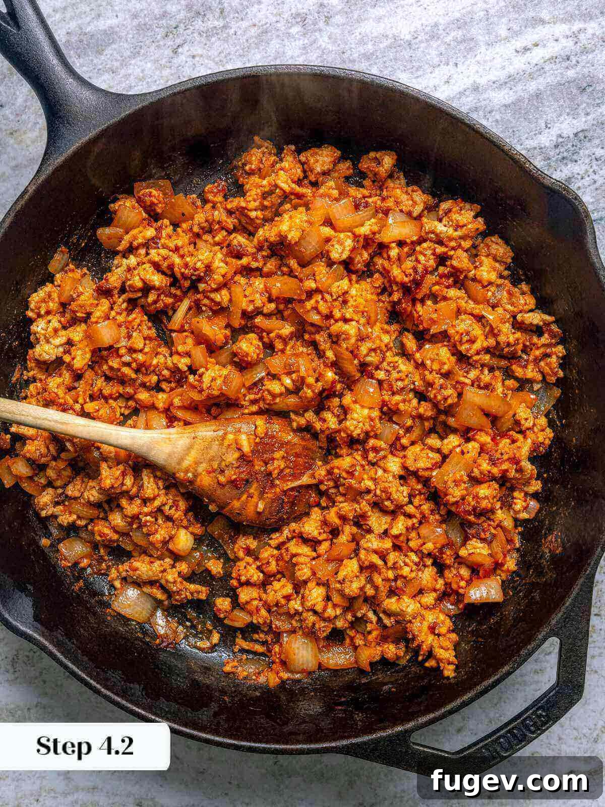 Zesty Ground Chicken Tacos 8 Close-up of perfectly cooked and seasoned ground chicken and chorizo taco meat in a skillet.