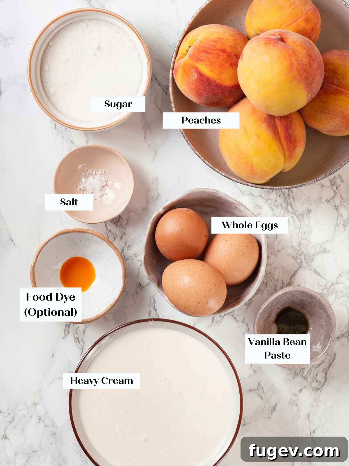 Luscious Peach Ice Cream 4 Ingredients for peach ice cream laid out on a marble surface, including eggs, sugar, peaches, and cream.