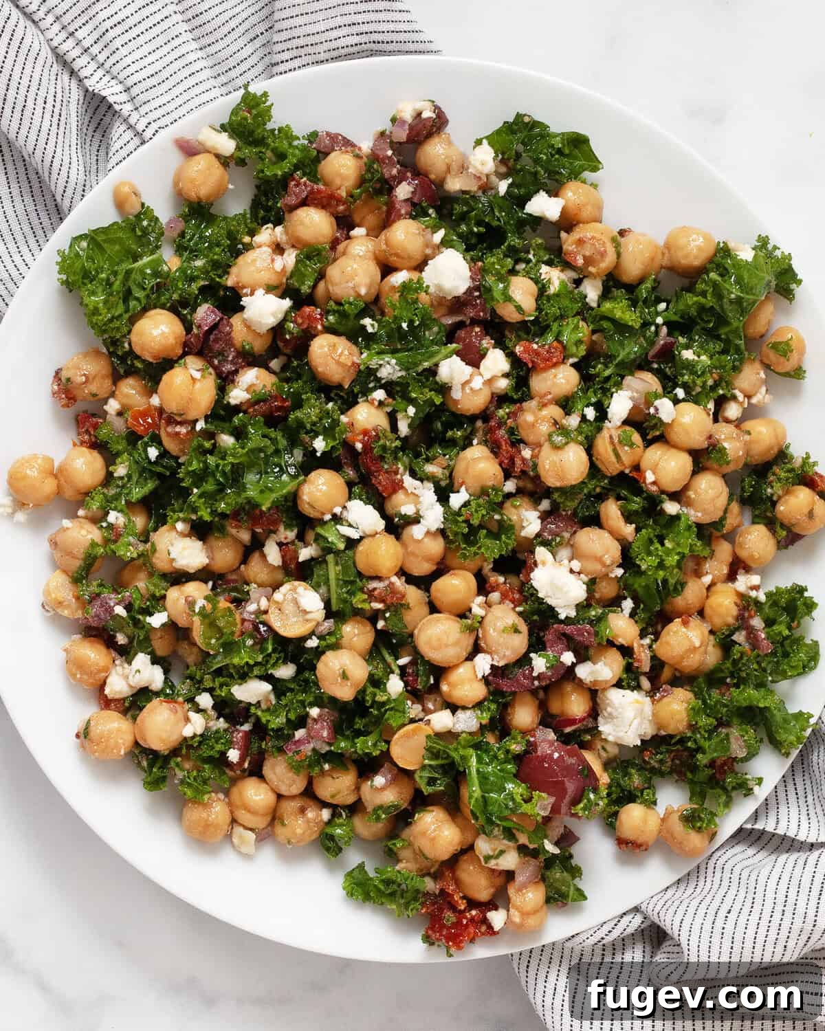 Green Goddess Chickpea & Kale Salad 2 A vibrant bowl of Mediterranean kale chickpea salad, perfectly chopped and ready to eat.