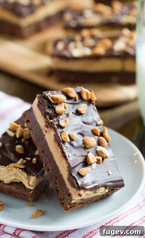 Irresistible Chocolate Peanut Butter Bars 3 Close-up of three-layer chocolate peanut butter bars with generous layers