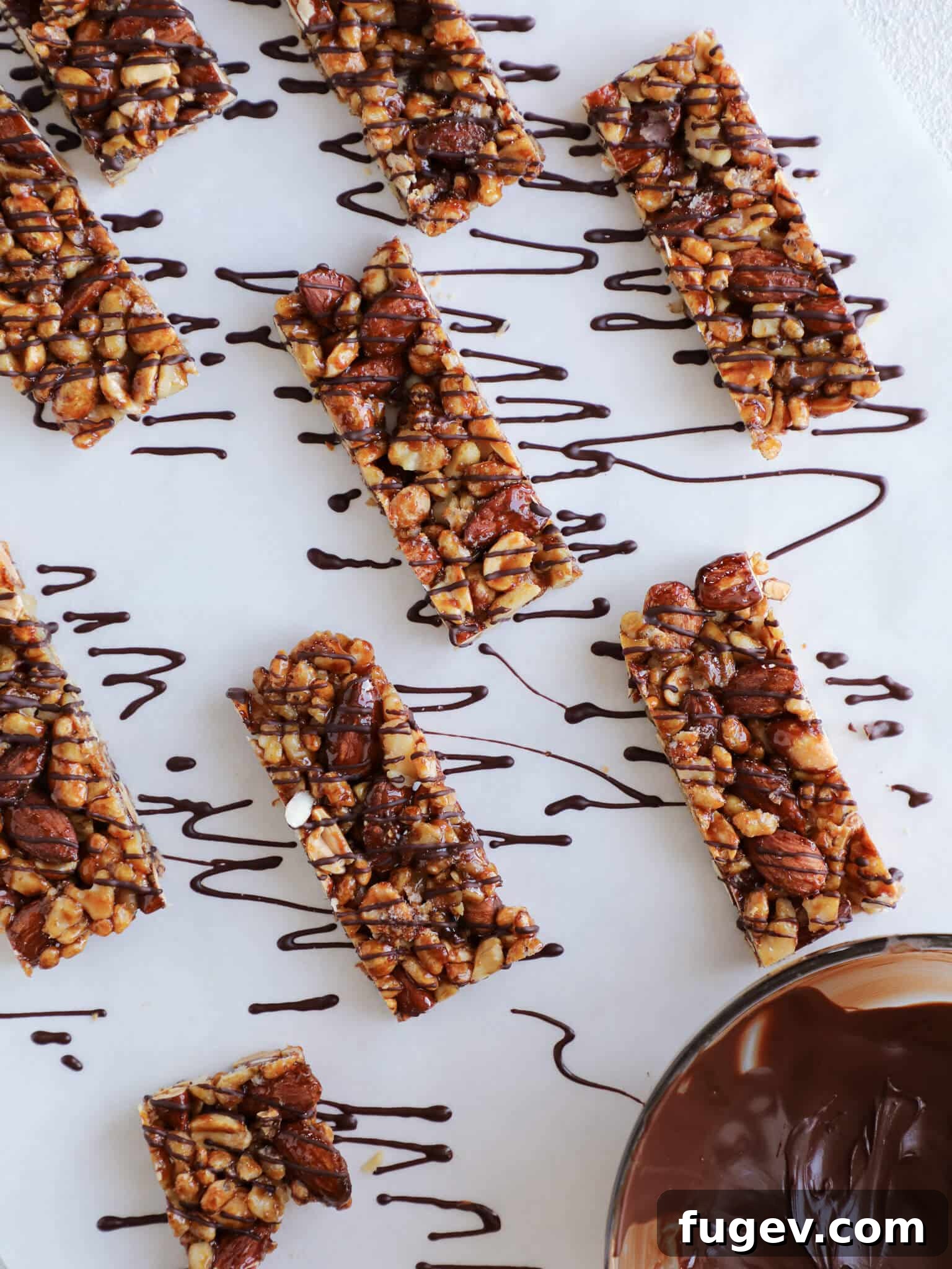 Craft Your Own KIND Bars 2 Homemade KIND Bars Copycat Recipe with generous chocolate drizzle, showcasing a stack of healthy nut bars.