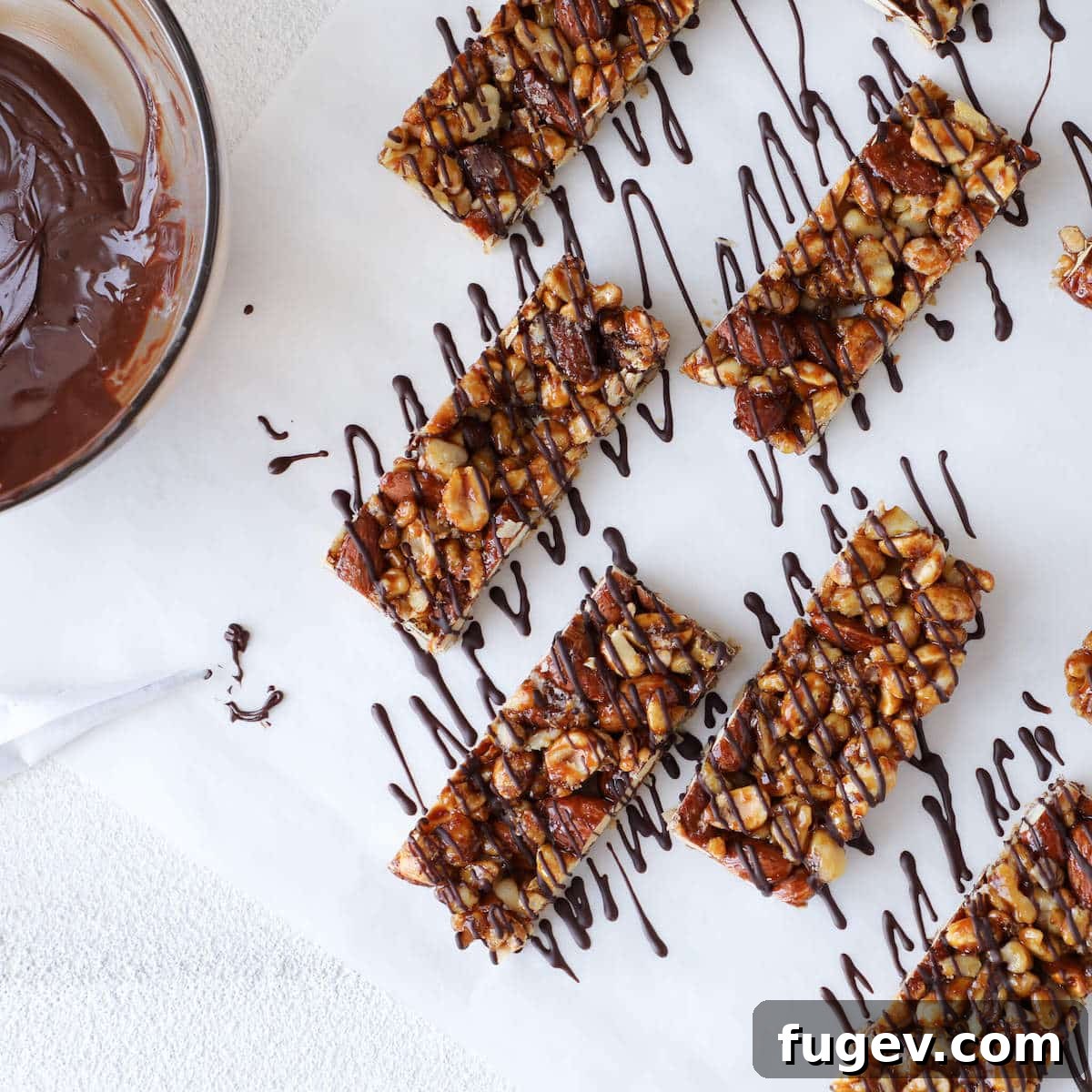 Craft Your Own KIND Bars 4 Melted dark chocolate ready for drizzling over homemade KIND bars, shown with a piping cornet.
