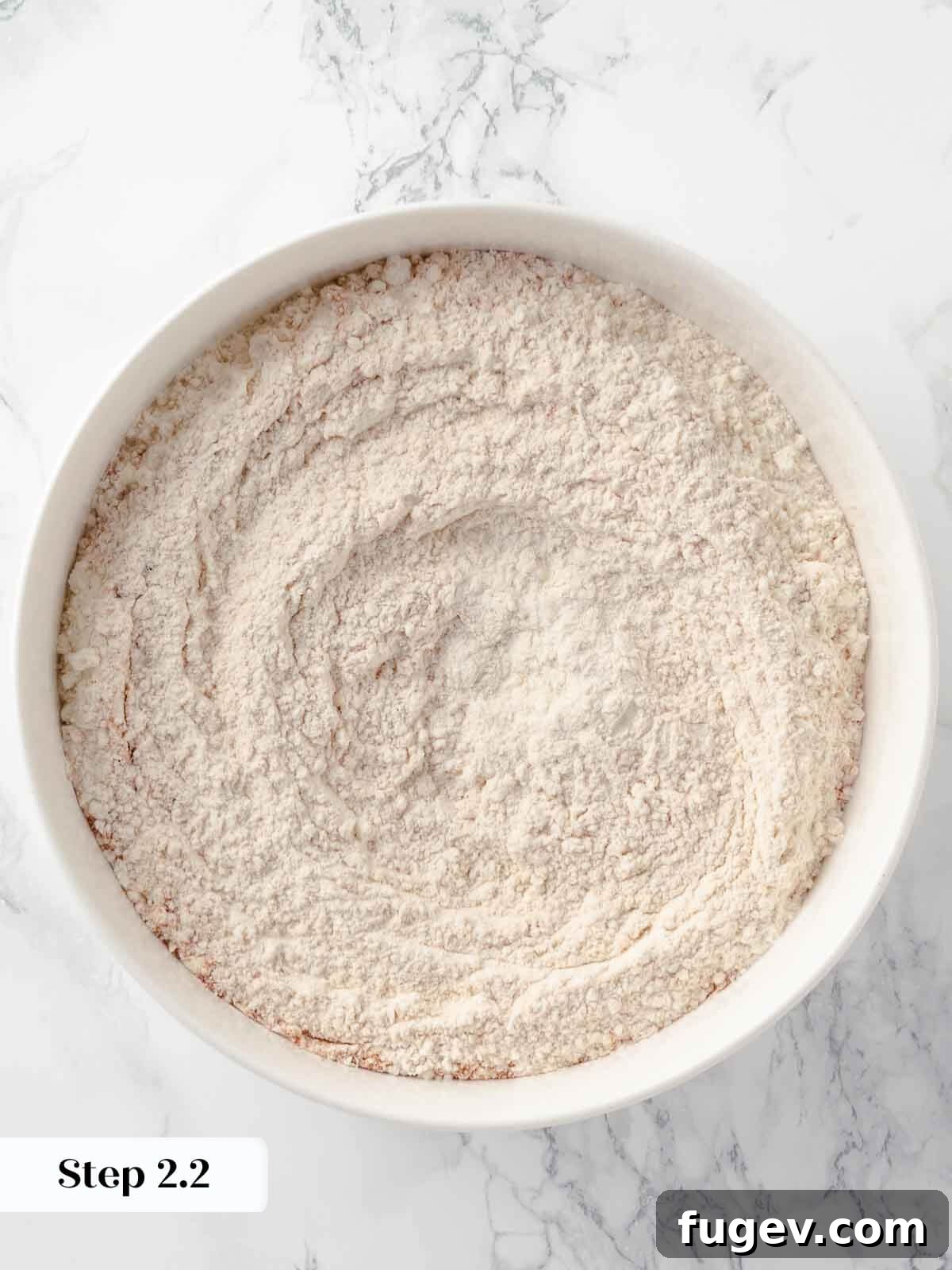 Harvest Apple Cider Donuts 7 A bowl of dry ingredients for apple cider donuts, perfectly mixed and ready for the next step.