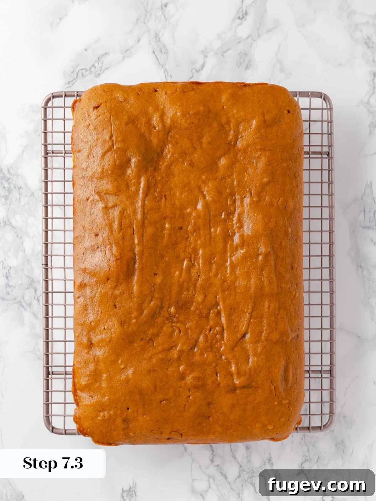 Autumn Pumpkin Spice Squares 12 The baked pumpkin bars are carefully placed on a metal wire rack to cool down completely before frosting.