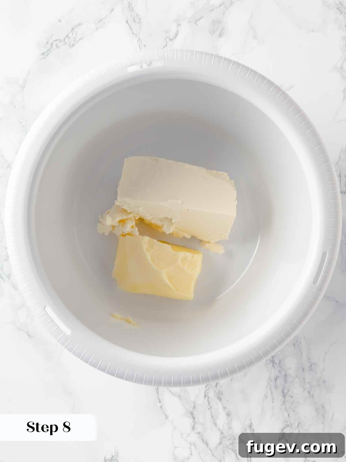 Autumn Pumpkin Spice Squares 13 Softened cream cheese and butter are being creamed together in a stand mixer bowl, forming the smooth base for the frosting.