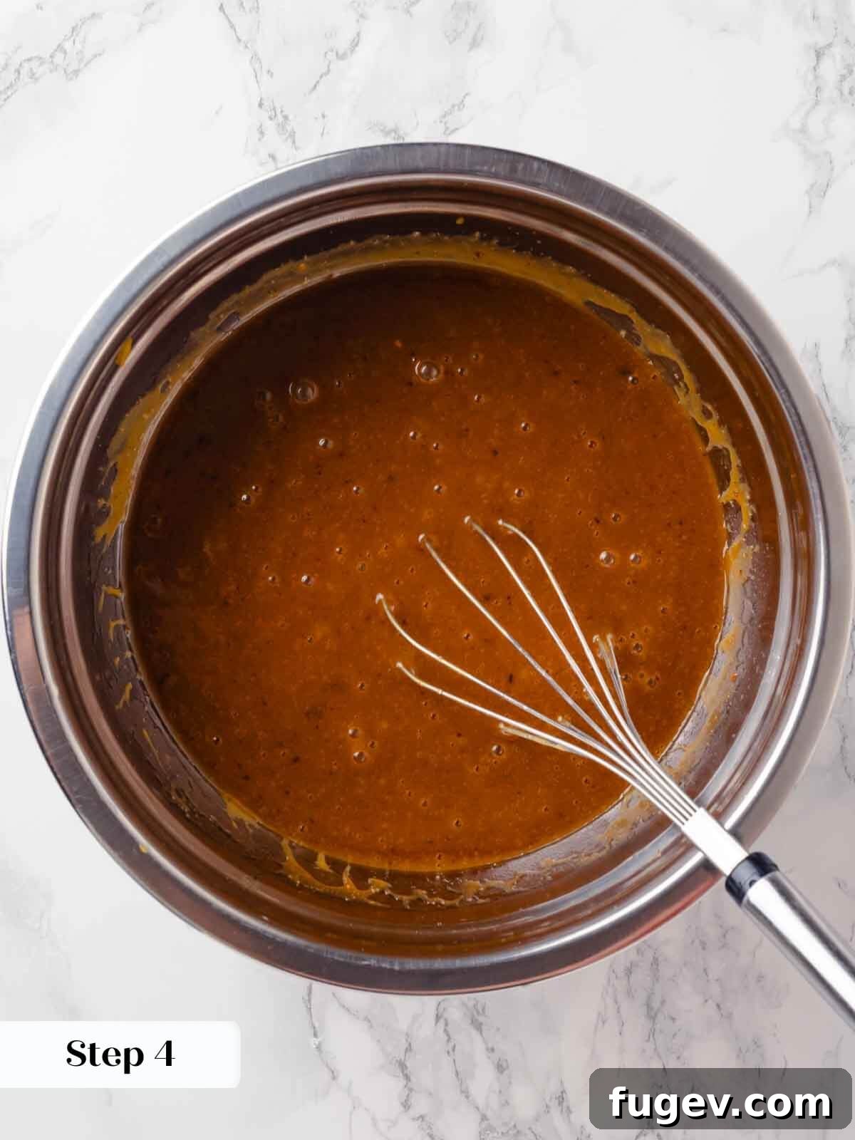 Autumn Pumpkin Spice Squares 7 Granulated and dark brown sugars are being added to the hot melted butter in a large bowl, ready to be whisked.
