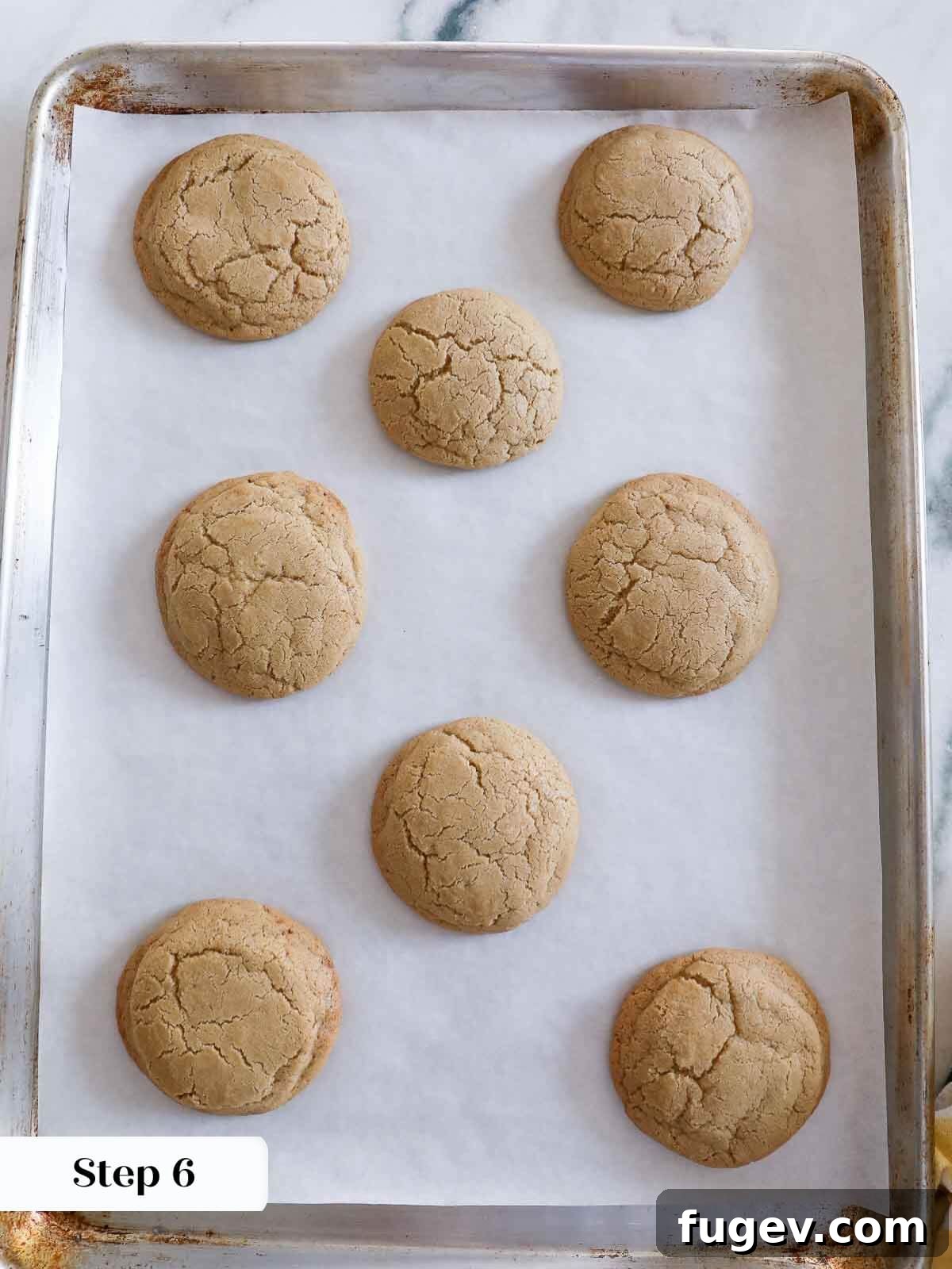 Sparkling Cinnamon Delights 8 A stunning display of freshly baked cinnamon sugar cookies, golden brown and perfectly formed, cooling on a wire rack.