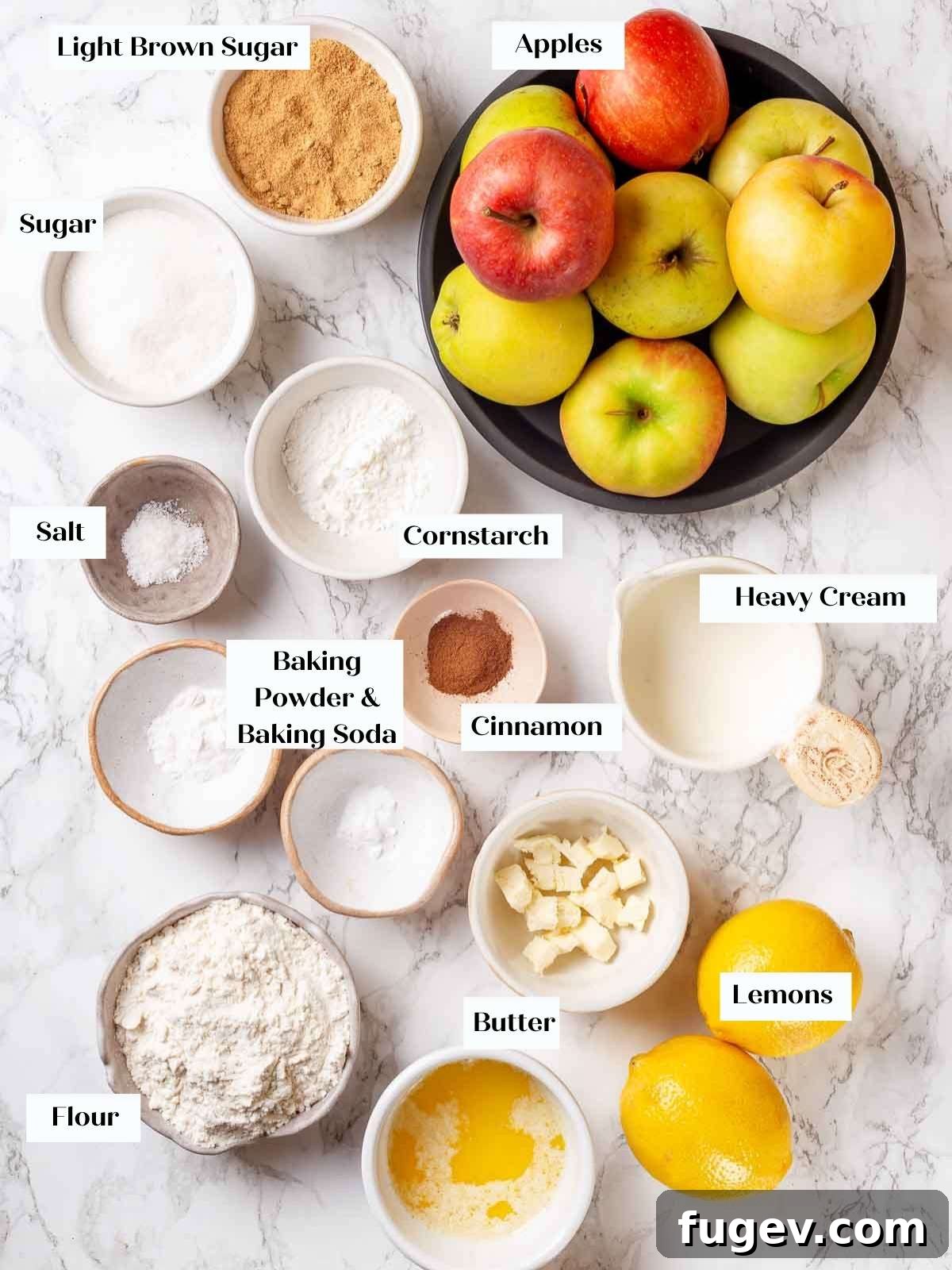 Cozy Apple Cobbler Magic 4 Carefully arranged fresh ingredients for making a delicious apple cobbler on a light marble surface, showcasing their quality and readiness.