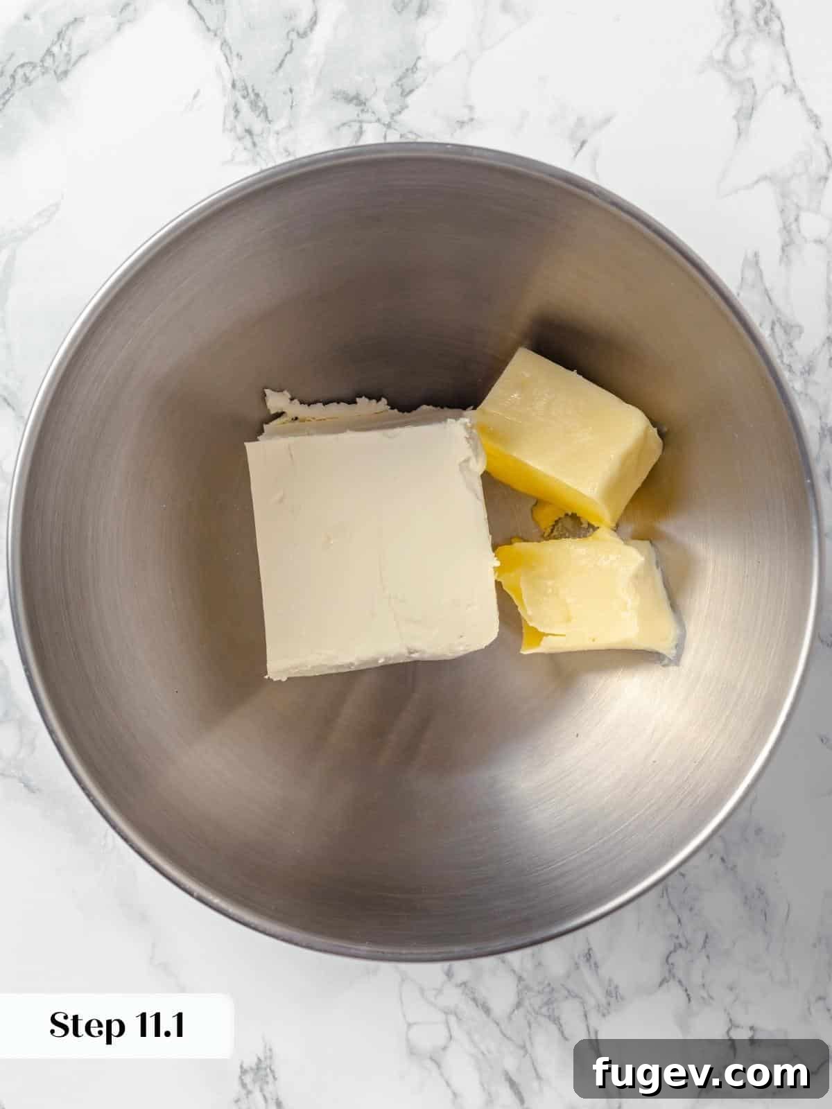 Ingredients for the frosting in a bowl before mixing for the applesauce cake.