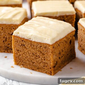 Applesauce cake displayed on a clean white countertop.