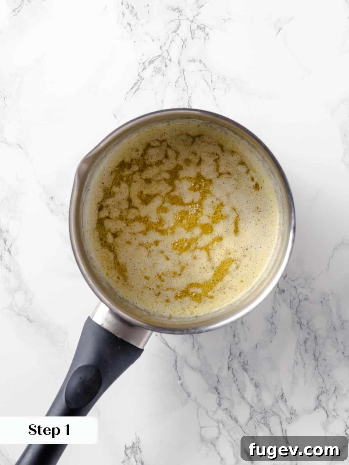 Butter melting in a saucepan for the applesauce cake.