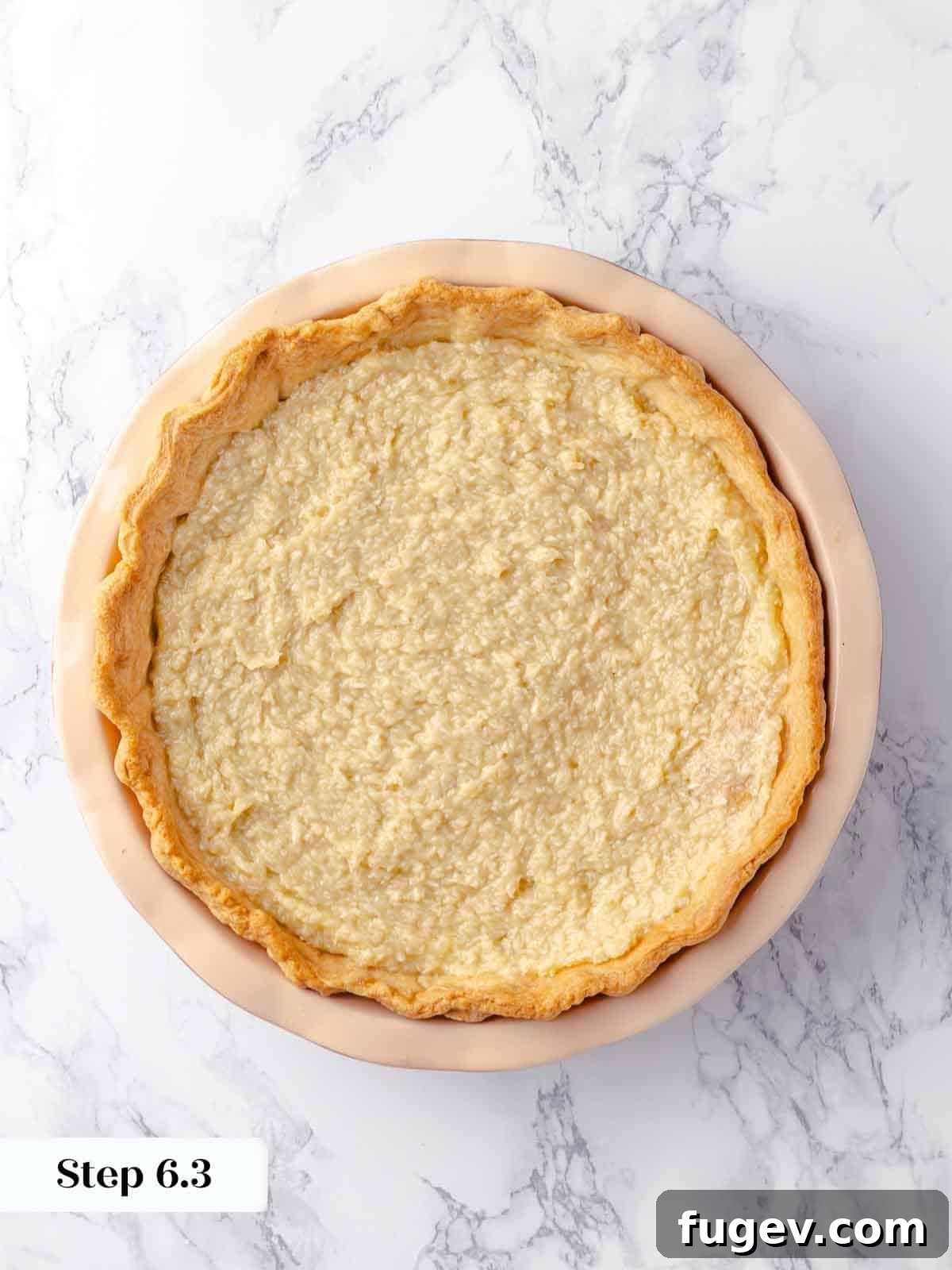 Luscious Coconut Cream Pie 12 The creamy coconut filling, perfectly smoothed, has been poured into the golden, blind-baked pie crust and is now ready for its essential chilling period.
