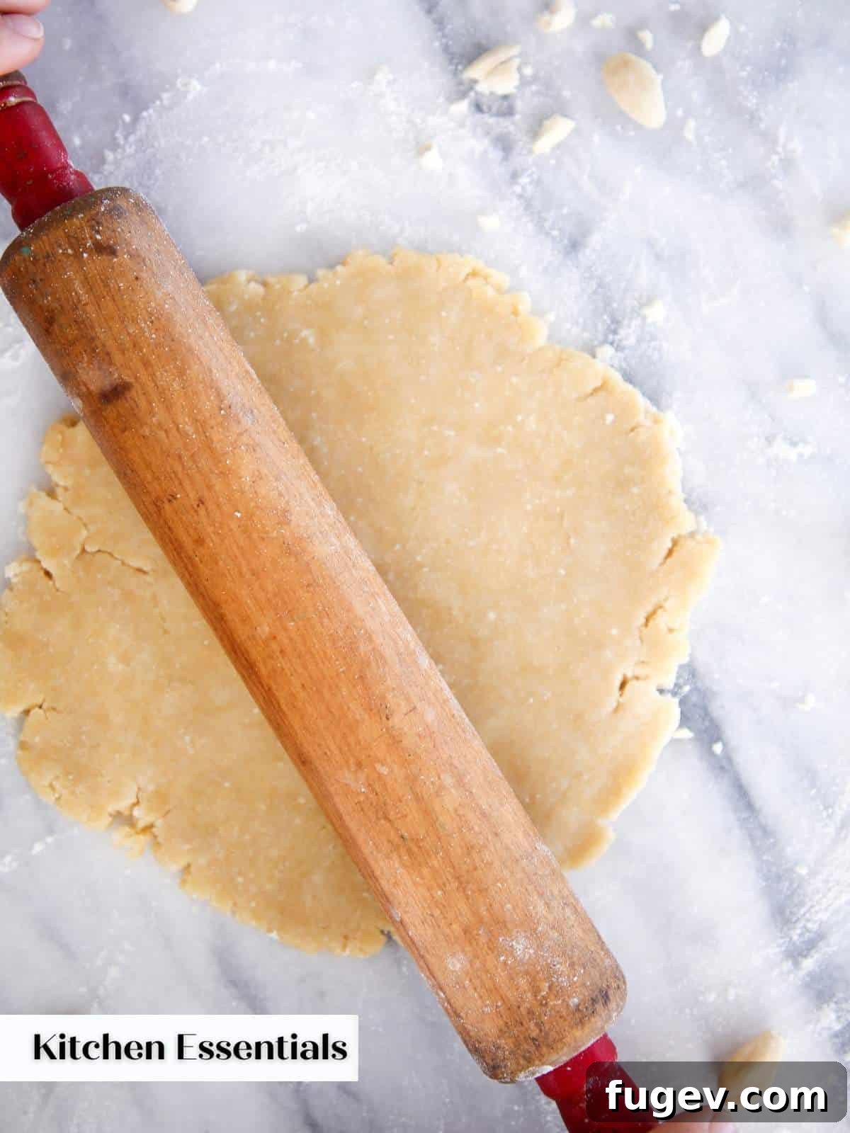 Gifts to Delight Any Home Cook 3 A finely crafted wooden rolling pin rests on a rustic countertop, surrounded by a dusting of flour and freshly prepared pie dough, symbolizing traditional baking.
