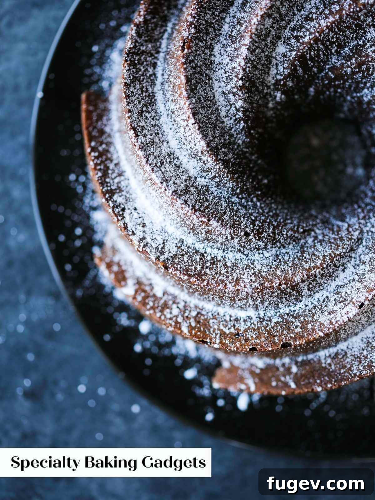 Gifts to Delight Any Home Cook 10 A rich, dark chocolate pound cake beautifully dusted with powdered sugar, elegantly presented on a table, highlighting its intricate Nordicware bundt pan design.