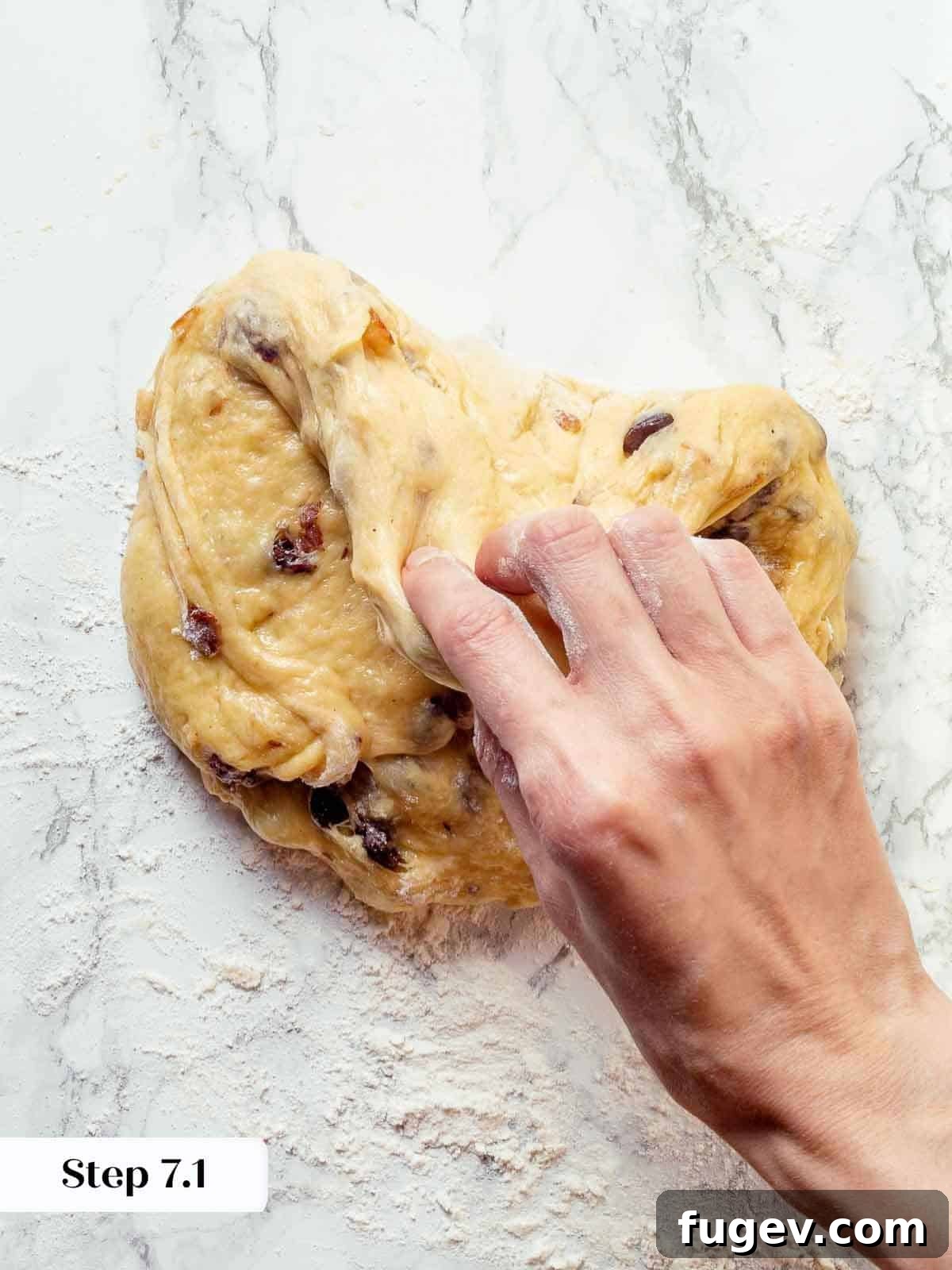 Traditional Italian Panettone 12 The four corners of panettone dough carefully folded inward on a clean work surface, beginning the pre-shaping process.