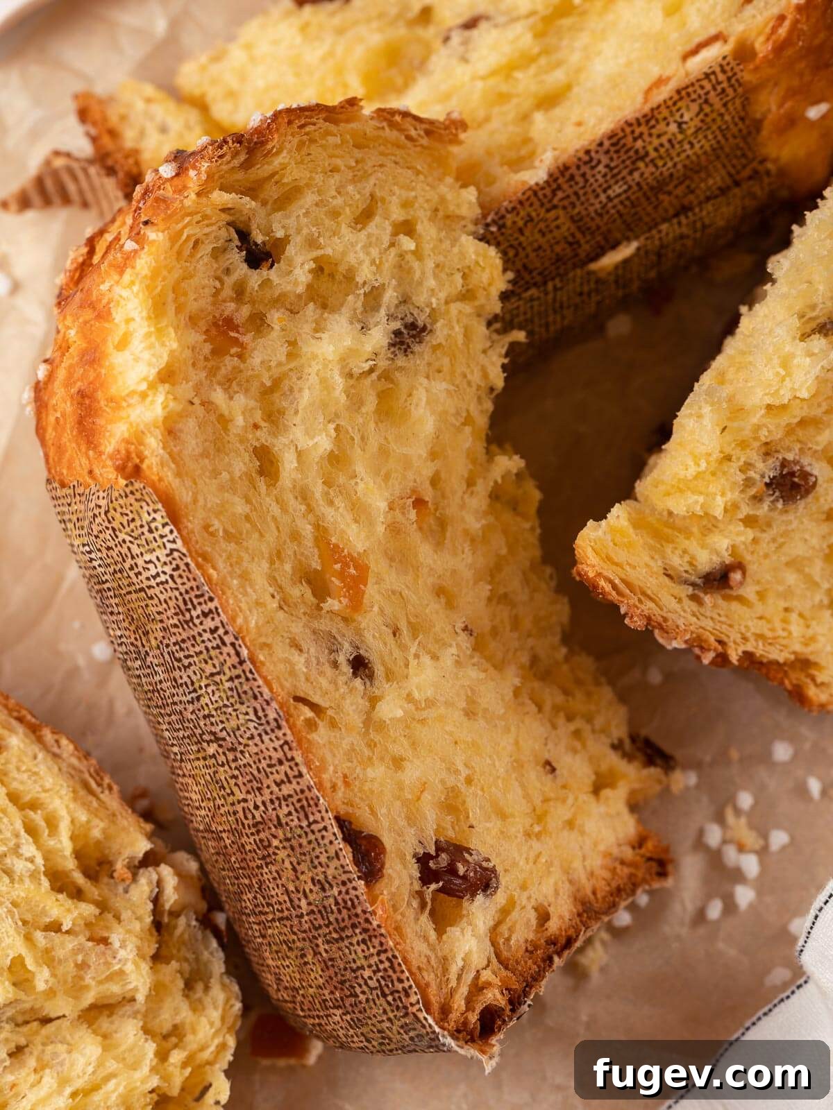 Traditional Italian Panettone 20 A loaf of freshly baked panettone, sliced to reveal its incredibly soft, buttery, and fruit-filled interior, inviting a delightful taste.