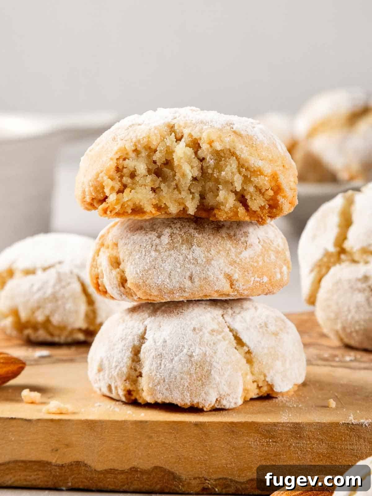 Italian Almond Amaretti 13 A vibrant close-up of amaretti cookies ready to be enjoyed, showcasing their perfect texture and powdered sugar coating.