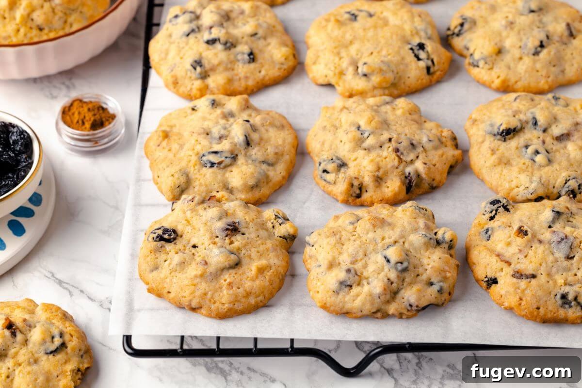 Old Fashioned Spiced Hermit Bars 3 Hermit cookies with a golden exterior, emphasizing their perfectly baked look.