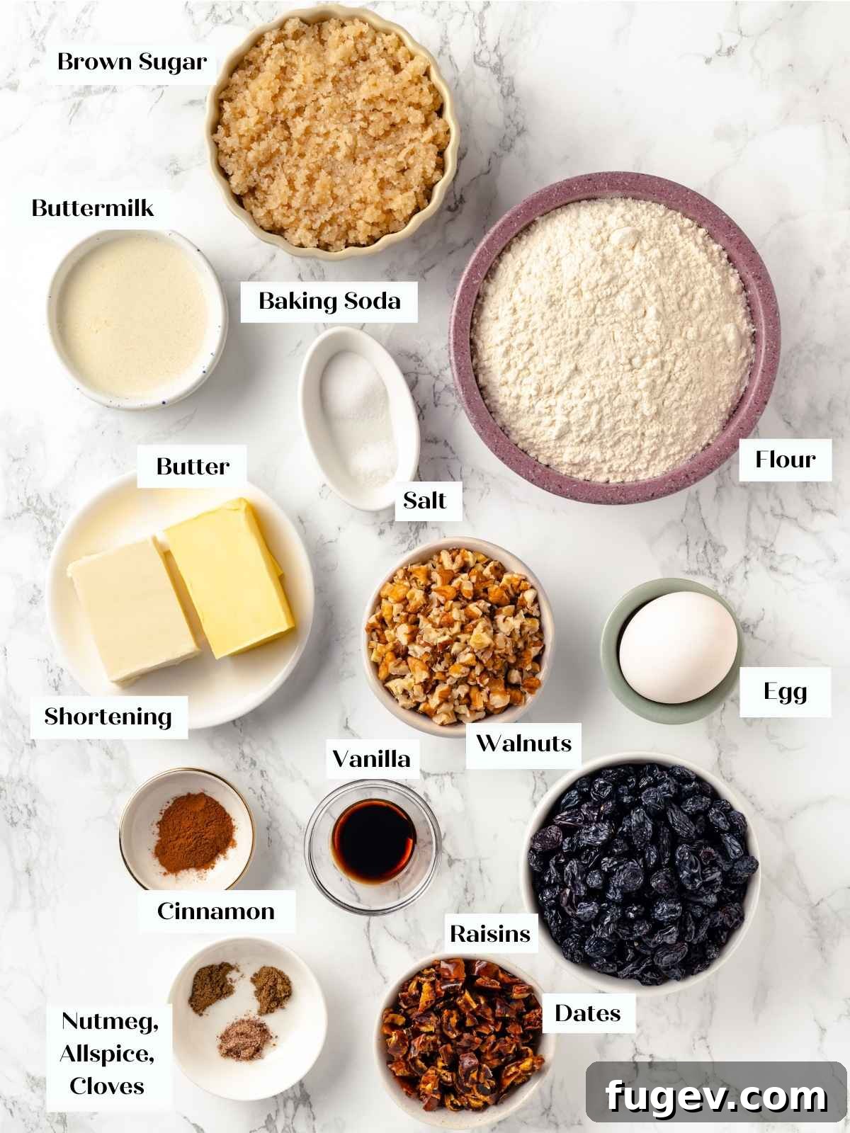 Old Fashioned Spiced Hermit Bars 4 A flat lay of ingredients for hermit cookies, spread on a white marble surface.