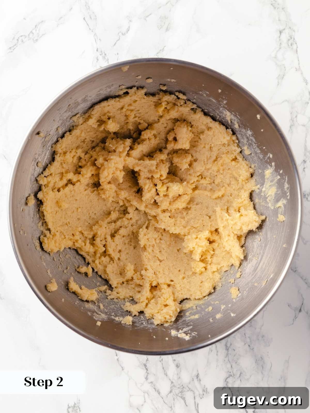 Old Fashioned Spiced Hermit Bars 5 Butter and sugar being creamed together in a mixing bowl.