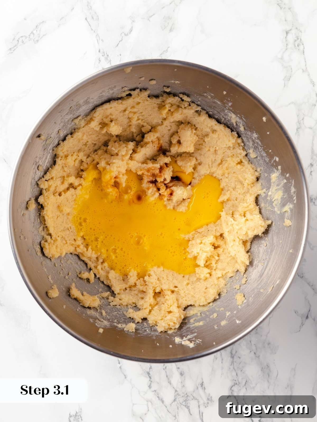 Old Fashioned Spiced Hermit Bars 6 An egg being cracked and added into the wet ingredients mixture in a bowl.