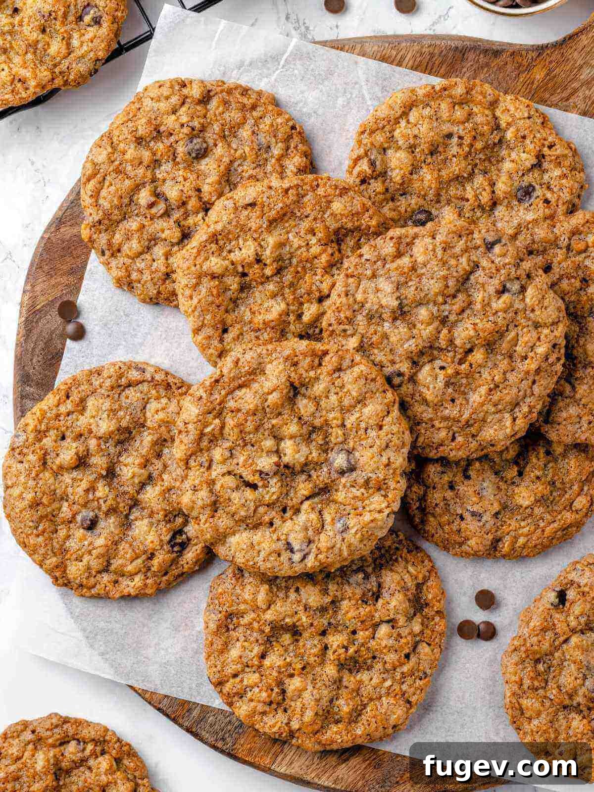 Hearty Cowboy Cookies 16 A freshly baked tray of golden cowboy cookies with visible mix-ins cooling on a wire rack, showcasing their rustic and inviting texture.