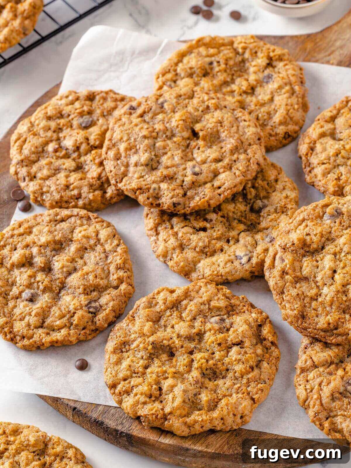 Hearty Cowboy Cookies 5 A close-up shot of golden brown cowboy cookies, showcasing their inviting crisp edges and wonderfully chewy centers, fresh from the oven.